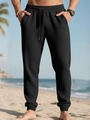 Detalle del jogger negro de hombre en tejido gofrado con cordón y textura marcada - S / Negro