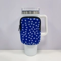 Detail of blue neoprene sleeve with white paw prints and zipper for 40oz tumbler - No. 13 Blue Paw