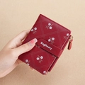 Short red quilted PU leather wallet with white floral pattern and gold side zipper - Red
