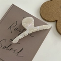 Detail of pearl white acetate hair clip with France handmade lettering on a book - Extra Large Gold Label Hanger Claw Clip