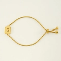 Adjustable golden stainless steel bolo bracelet featuring an openwork letter G pendant - Letter G / Gold
