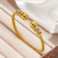 Twisted cable cuff bracelet in gold finish featuring rhinestone-encrusted spheres - Gold Twisted Ball Style (szgss134 Gold) / Gold