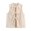 Front view of cream lace-up vest featuring textured fabric and three bow tie closures - S / Off White