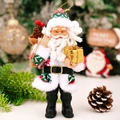 Statuetta di Babbo Natale in cappotto nordico verde con scatola regalo dorata - Babbo Natale in Resina Rosso e Verde