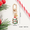 Detail of a Christmas tree keychain with white pearl and dimensions shown in macro view - Drip Oil Green Christmas Tree