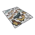 Detail of soft white flannel blanket featuring colorful butterfly patterns and black hem edging - Cream Vintage Butterfly