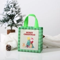Detail van groene geruite kerstcadeautas met Kerstman en de tekst Merry Christmas - 23*22*11cm / Groen Geruit Kerstman