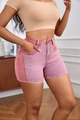 Detail of high waisted denim shorts in pink and purple patchwork color block design - 2XL / Purple