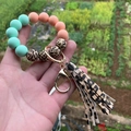 Close-up of silicone beaded keychain with leopard print tassel and gold ring - Style 16-Mint Green Pink Leopard/Leopard Tassel