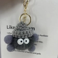 Grey mink fur coal ball keychain with a small knitted hat and cute cartoon eyes - Dark Gray