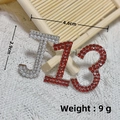 Star rhinestone brooch with J-shape pearl and red crystal lettering details - Silver J13 Red Rhinestone