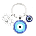 Silver keychain with blue evil eye glass charm and hollow eye pendant decoration - Circular Eye Pattern (4)