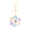 Handmade woven daisy keychain with blue and purple petals and golden metal alloy ring - Style 5 Purple Light Blue Beige
