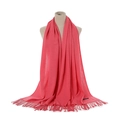 Detail of coral pink cashmere-feel scarf with knit texture and long twisted tassels - Watermelon red