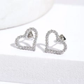 Close-up of heart-shaped silver earrings with micro-paved cubic zirconia stones - Silver With White Zirconia (E009)
