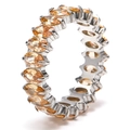 Detailed view of silver eternity ring featuring oval-cut champagne gemstones in a full pavé setting - Silver + Champagne Zirconia