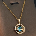 Starry planet necklace with blue Saturn pendant and gold crescent moon on display card - Gold - Blue Saturn Crescent