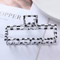Detail view of large black and white checkerboard hair claw clip with matte texture - 1# Black and White Plaid Metal Claw Clip