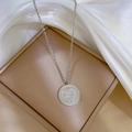 Detailed shot of silver heart pendant with crystals on a jewelry box and silk cloth - Titanium Steel / Silver