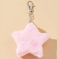 Pink plush star keychain charm with fluffy texture and silver metal clip on warm beige background - Pink