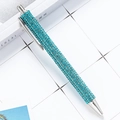 Sky blue crystal retractable ballpoint pen with polished silver trim on a desk - Lake Blue (Silver Parts)