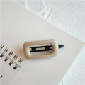 Sweet minimalist beige square hair clip with black metal grip on a spiral notebook - Square Beige