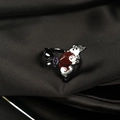 Macro view of butterfly ring with enamel wings and gems on black silk background - Adjustable Open / Black Metal White and Red Enamel Butterfly (JZ4186)