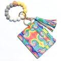Detail of tie-dye wallet with silicone beads wristlet and leather tassel keychain set - Green Tie Dye