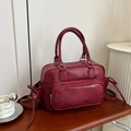 Mochila vintage granate en ecopiel con lazos decorativos y detalles dorados - Burdeos