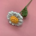 Handmade crochet daisy flower with white petals and yellow center on pink background - White Camomile