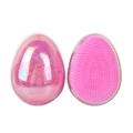 Pink glitter egg-shaped hairbrush showing both front bristle pad and back shell view - Starry Pink Holographic