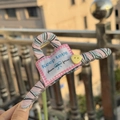 Striped fabric hair claw clip featuring Keep Love text patch and yellow heart accent - Pink Green Stripe Claw Clip with Yellow Heart Button and Label