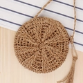 Khaki round woven straw bag with decorative tassel and thin shoulder strap for summer travel - Camel