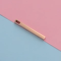 Macro detail of a rose gold rectangle bar pendant with a polished finish and top hole - Rose Gold