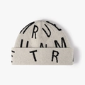 Bonnet en maille avoine avec motifs de lettres jacquard noires et revers épais - Beige