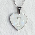 Elegant heart-shaped necklace featuring a white shell inlay and a metal letter I pendant - Letter I / Silver