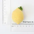 Handmade crochet lemon keychain pendant in bright yellow yarn with green leaf detail - Combed Cotton Knitted Lemon