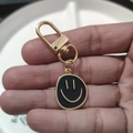 Golden alloy keychain with black enamel smiley face charm for bags and purses - Large Single Black