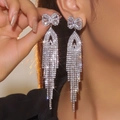 Luxuriöse lange Quastenohrringe mit Schleife und glänzenden Silber-Zirkonia-Steinen - Schleife Lange Quaste / Silber
