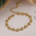 Elegante bracciale a stella placcato oro con zirconi brillanti e catena regolabile - Stella