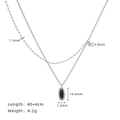 Double-layered silver titanium steel necklace featuring a black oval pendant and bead chain - Silver