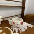 Hand-painted ceramic coffee mug with red bow and blue hearts on white surface - Red Large Bow
