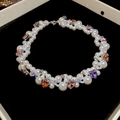 Close-up of irregular pearl necklace with colorful crystal heart pendants on black velvet - Multicolor Heart Pearl Necklace (HN9273)