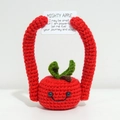 Handmade red crochet apple doll holding a Mighty Apple positive energy card - Red Apple