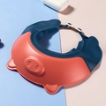 Adjustable silicone baby shower cap featuring a red and blue pig design with ear guards - Pig - Red and Blue