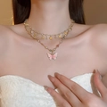 Close-up of a double-layer butterfly pearl necklace on a model wearing white lace - 18# Rhinestone Round Pearl Butterfly Necklace (2Pcs Set)