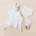Detail view of white muslin cotton baby comforter set with wooden ring and bib - 30*30 cm / White