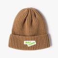 Caramel brown rib-knit beanie featuring trendy green letter patches for a modern look - Khaki