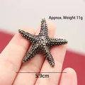 Ancient trilobite fossil metal ornament, bronze-toned desk decoration with 5.9cm diameter - Starfish Shape / Starfish