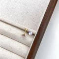 Sparkling pink crystal stud earrings with gold-tone finish in a jewelry tray - Light Pink Round (6mm)